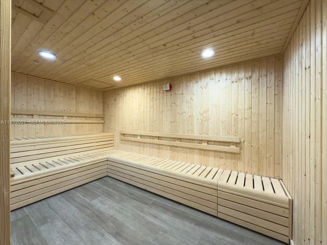 a view of a patio with dining table and chairs