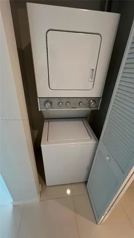 a view of kitchen with stainless steel appliances a sink and stove