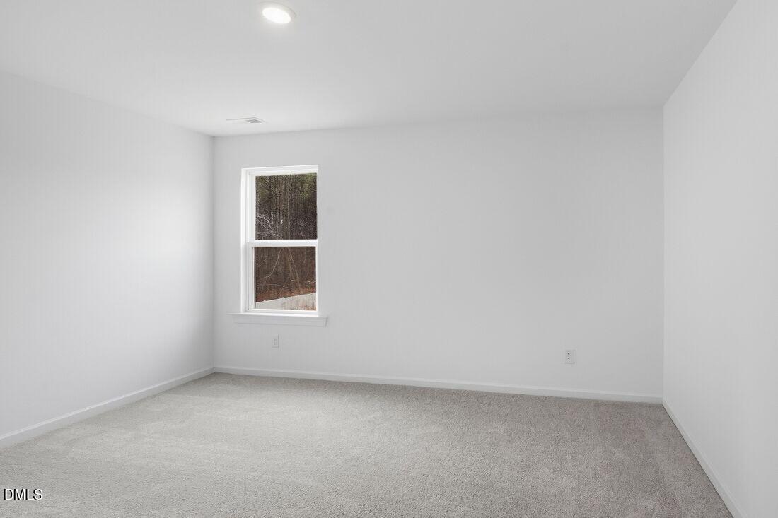 1208 Condor Jct Road Wendell, NC 27591 - Photo 15 of 57 an empty room with a window