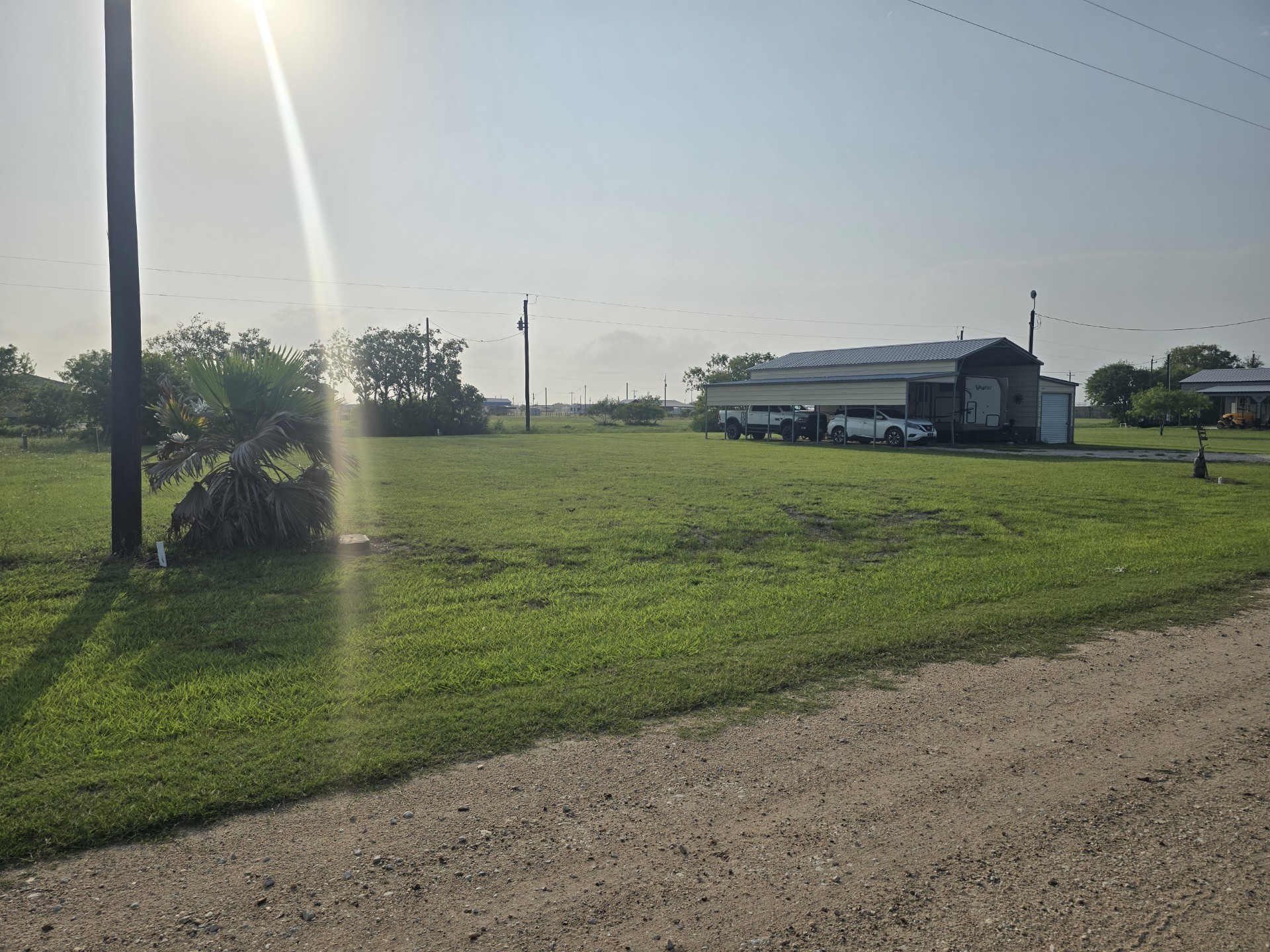 264 Haddock Palacios, TX 77465 - Photo 2 of 9 a view of a golf course with a lake