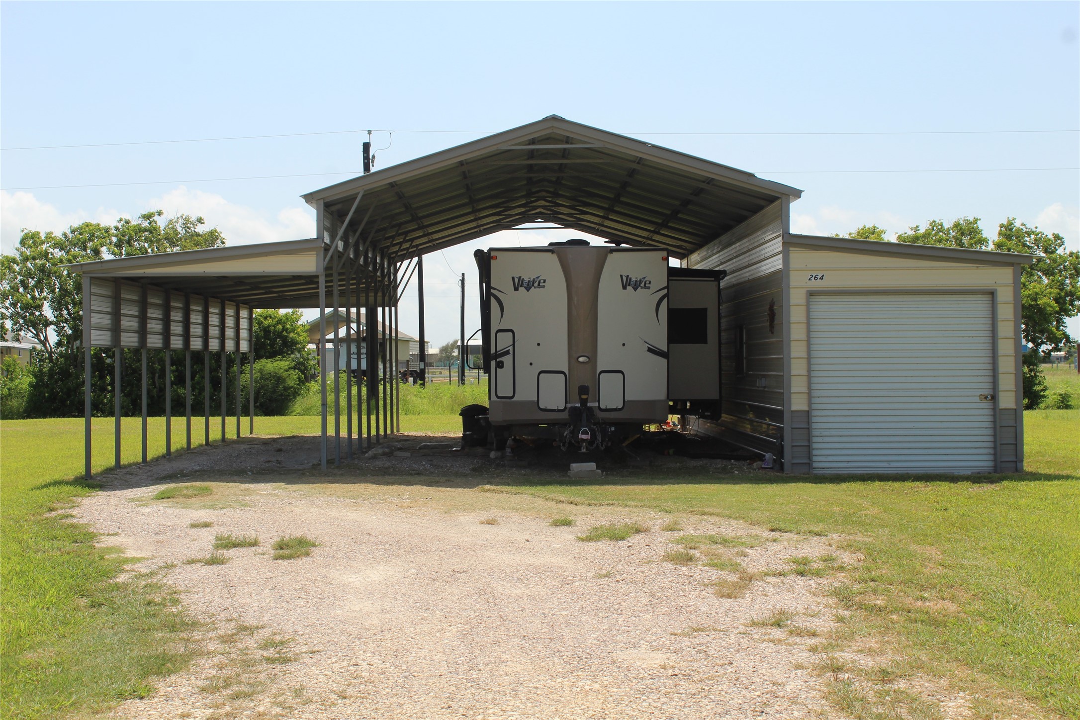 264 Haddock Palacios, TX 77465 - Photo 5 of 9 a view of a house with backyard and porch
