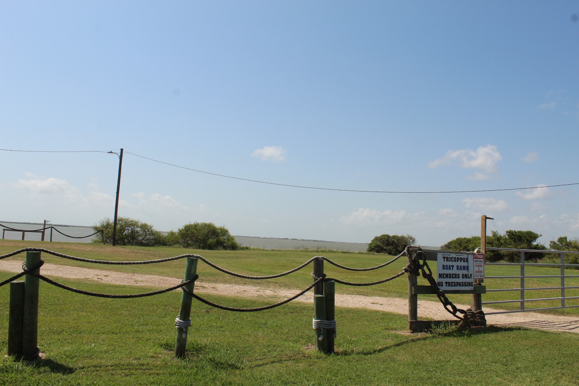 264 Haddock Palacios, TX 77465 - Photo 9 of 9 a view of a bench in a lake
