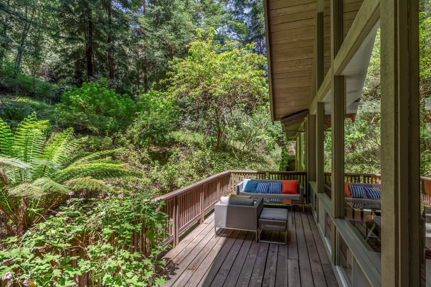 573 Patrol Road Woodside, CA 94062 - Photo 13 of 18 a view of balcony with wooden floor and outdoor seating