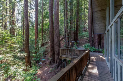 a balcony with trees in front of it