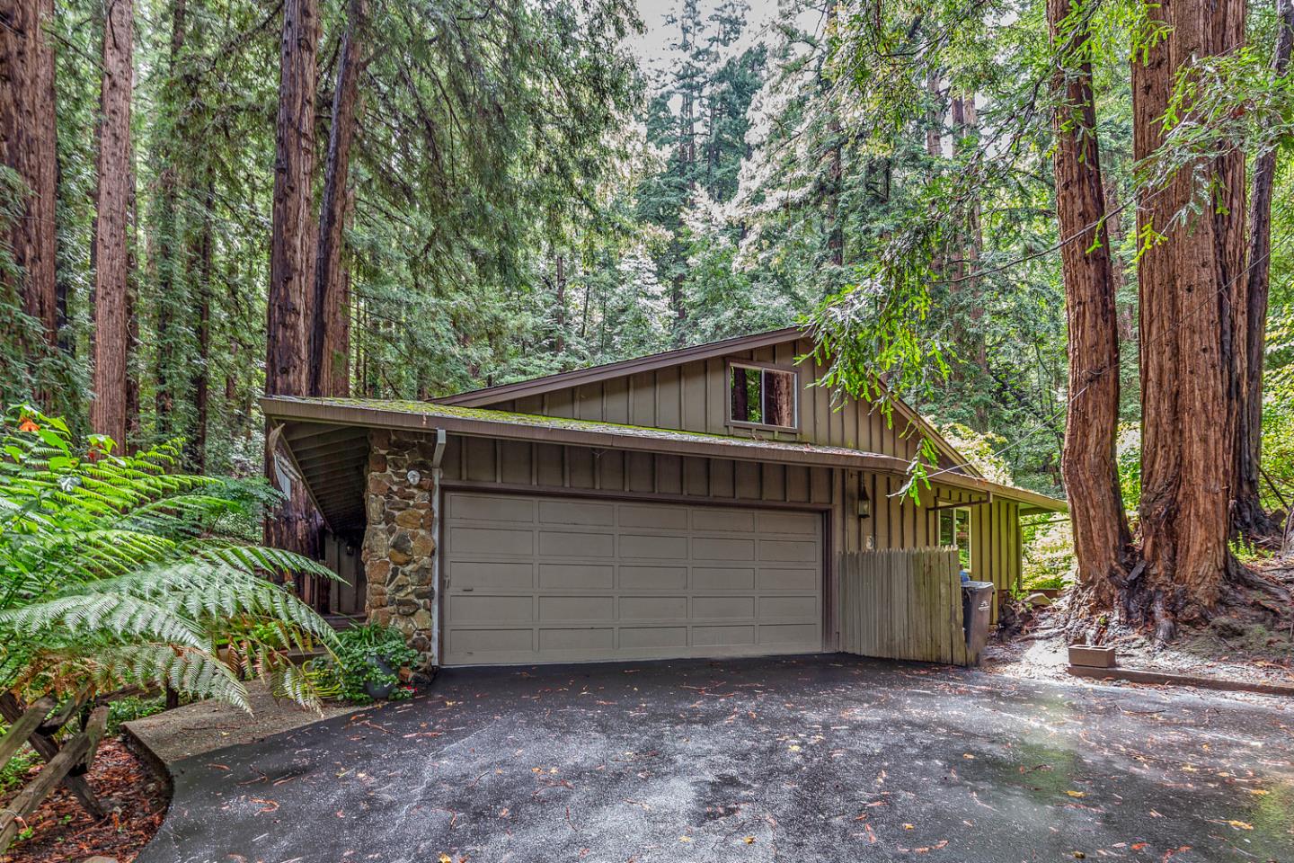 573 Patrol Road Woodside, CA 94062 - Photo 16 of 18 a view of backyard with large trees and wooden fence