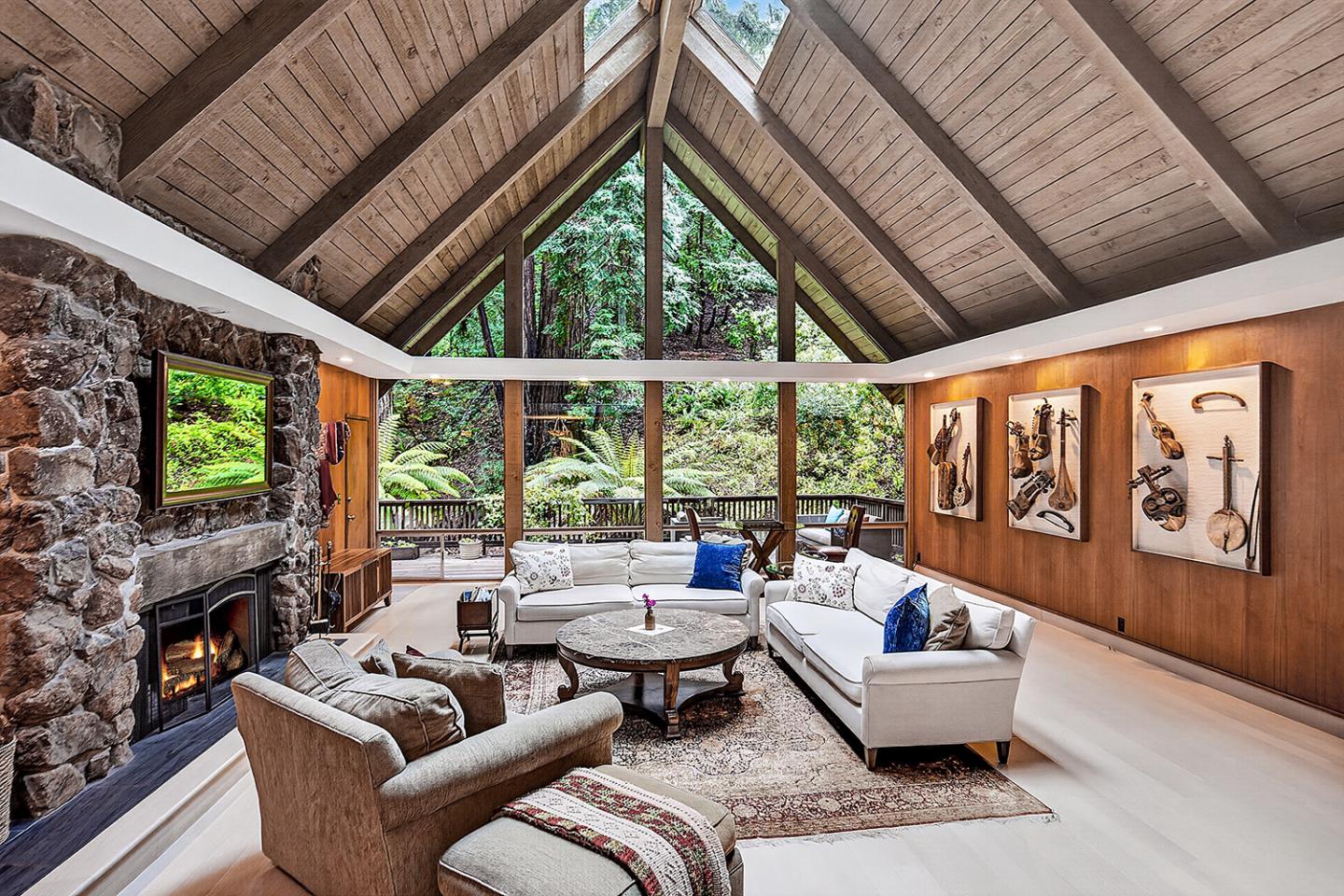 573 Patrol Road Woodside, CA 94062 - Photo 3 of 18 a living room with fireplace furniture and a large window