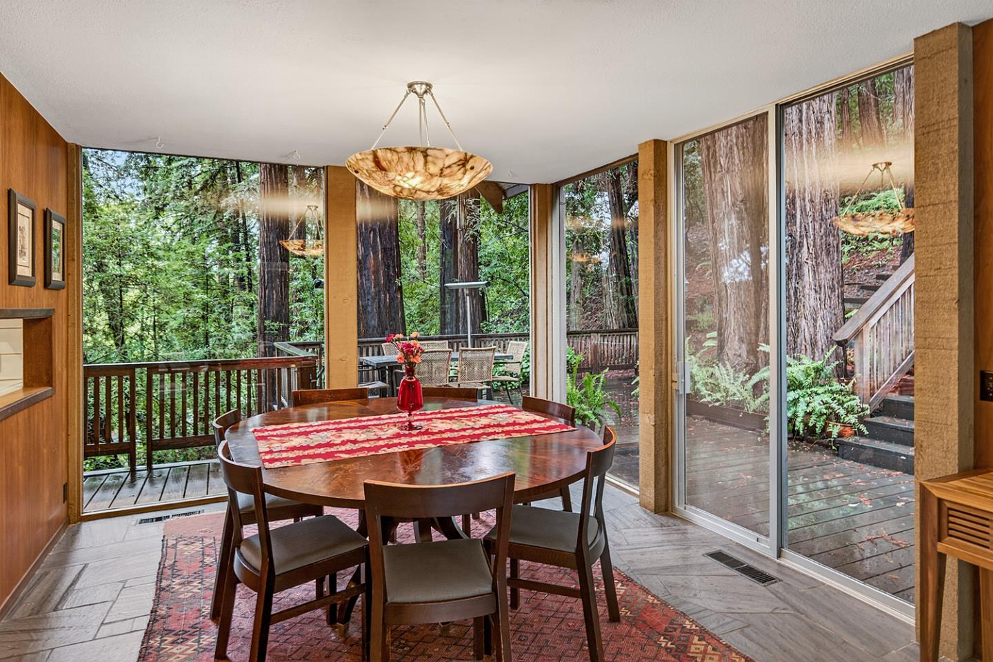 573 Patrol Road Woodside, CA 94062 - Photo 6 of 18 a view of a dining room with furniture window and wooden floor