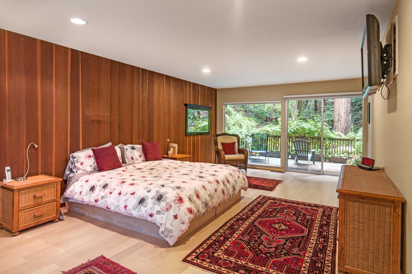 573 Patrol Road Woodside, CA 94062 - Photo 9 of 18 a bedroom with a large bed and a large window