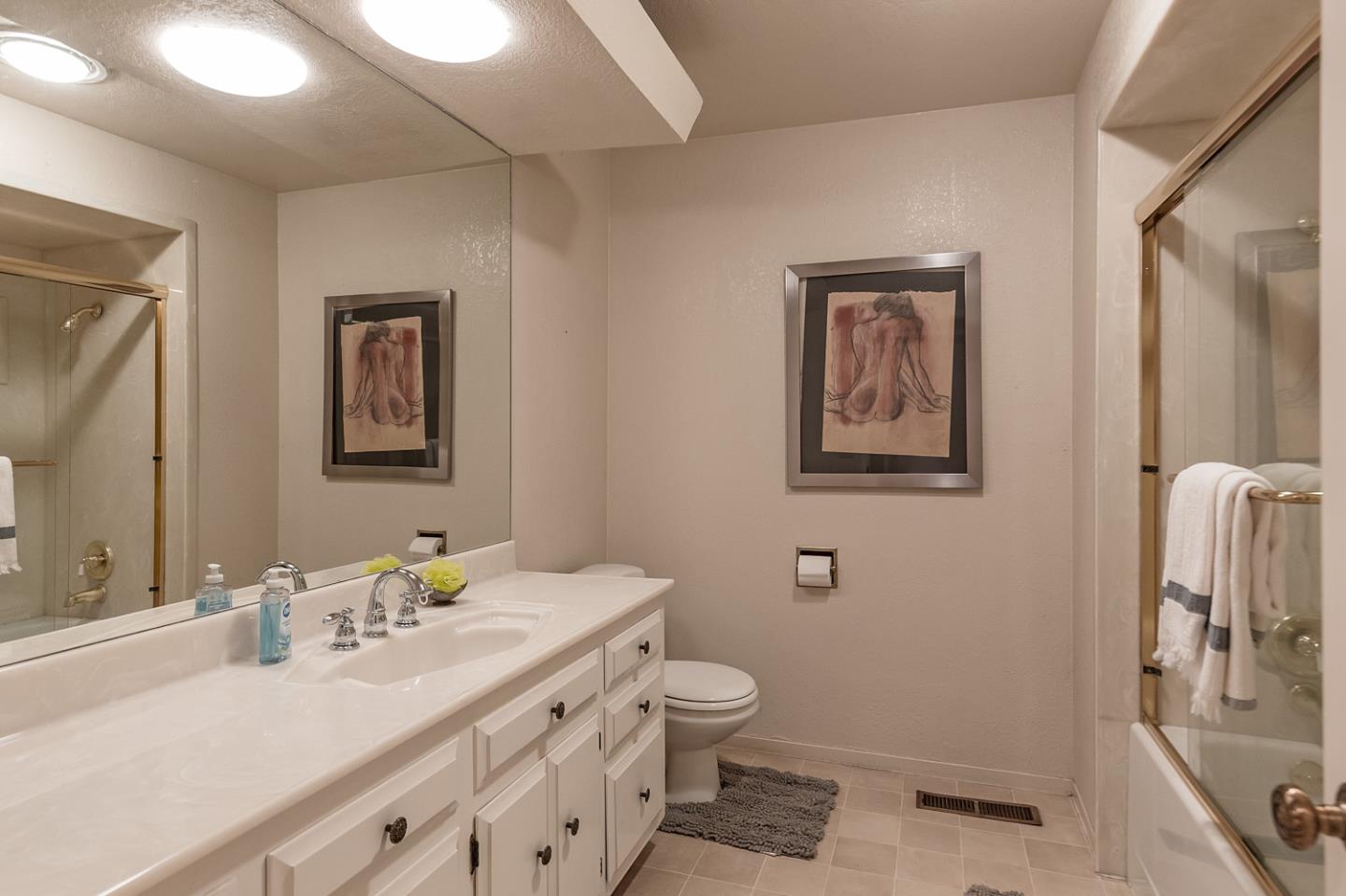 573 Patrol Road Woodside, CA 94062 - Photo 10 of 18 a bathroom with a sink a toilet and mirror