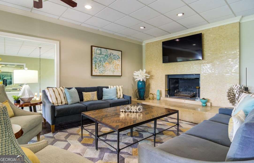 2383 Akers Mill Road Southeast, Unit L01 Atlanta, GA 30339 - Photo 18 of 30 a living room with furniture a flat screen tv and a fireplace