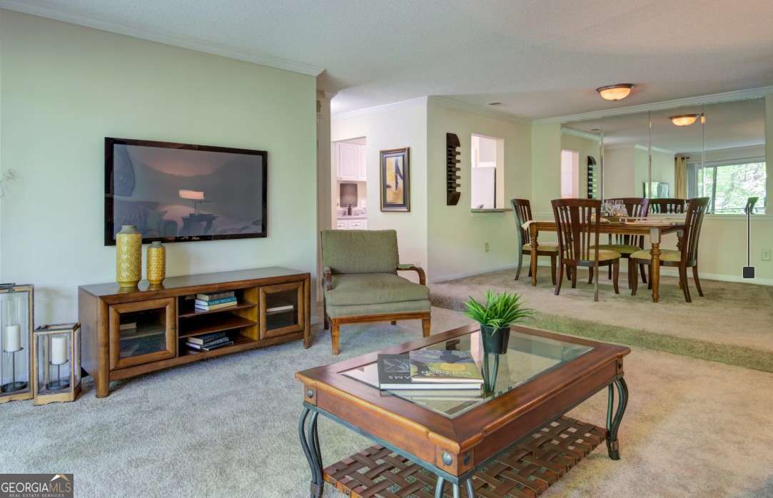 2383 Akers Mill Road Southeast, Unit L01 Atlanta, GA 30339 - Photo 22 of 30 a living room with furniture and a flat screen tv