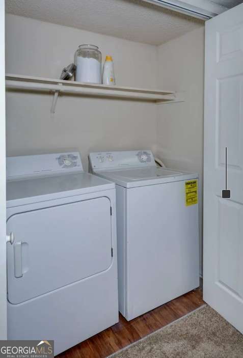 2383 Akers Mill Road Southeast, Unit L01 Atlanta, GA 30339 - Photo 29 of 30 a utility room with dryer and washer