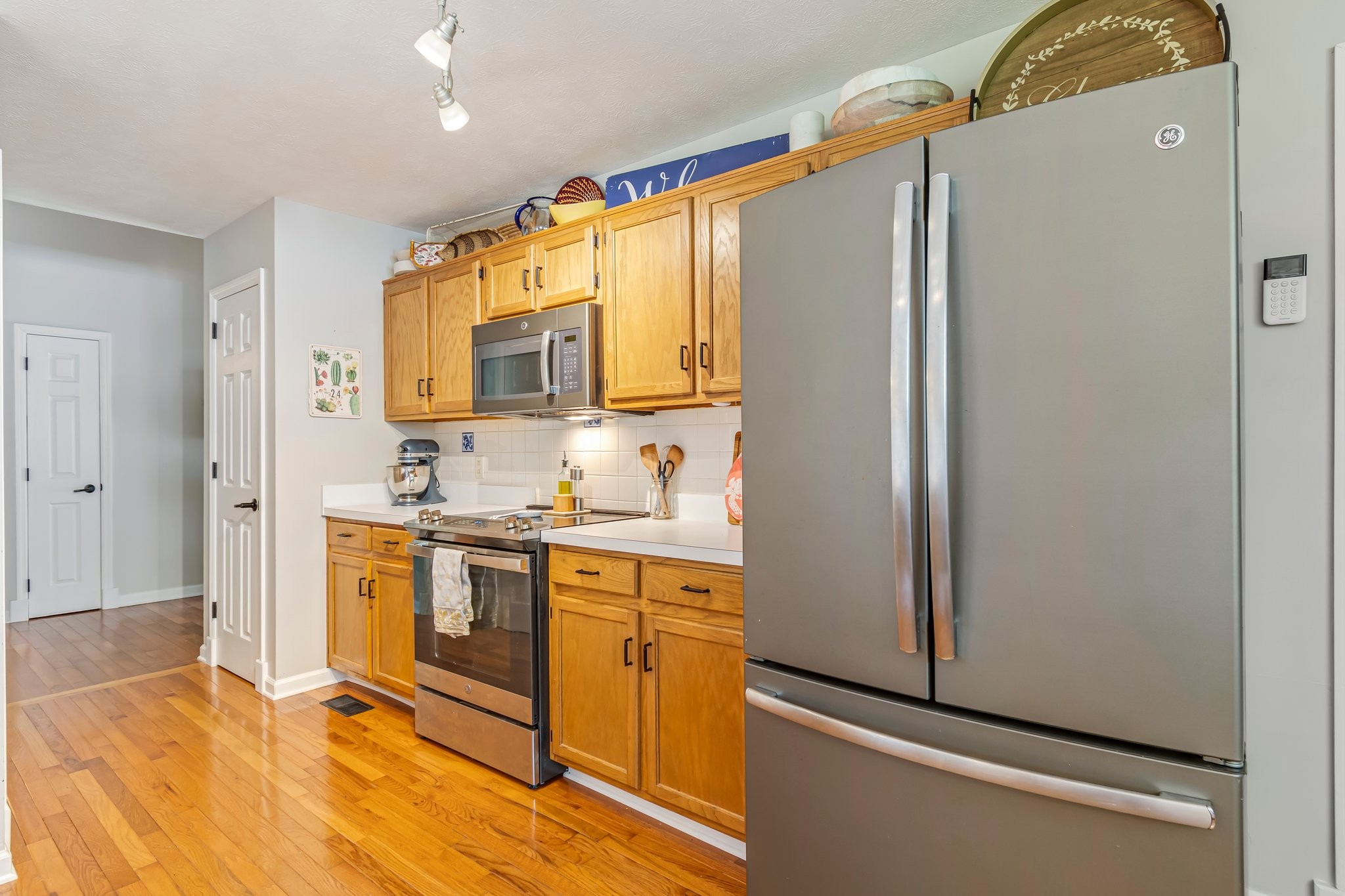 1817 Bryce Circle Nashville, TN 37211 - Photo 16 of 54 a kitchen with stainless steel appliances a refrigerator sink and white cabinets