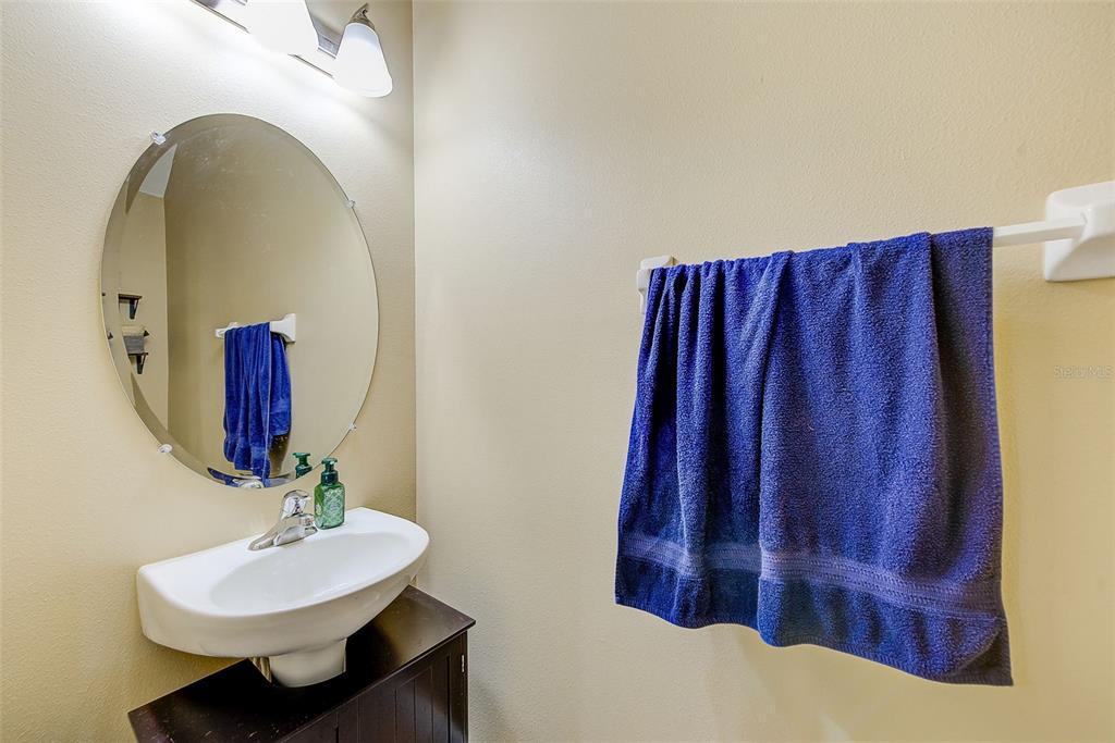 780 Spring Flowers Trail Brandon, FL 33511 - Photo 14 of 33 a bathroom with a sink and a mirror