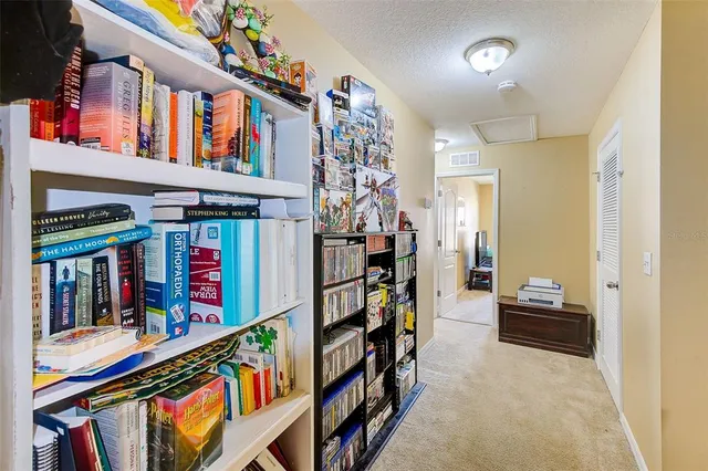 a bathroom with a granite countertop sink a light fixture and a mirror