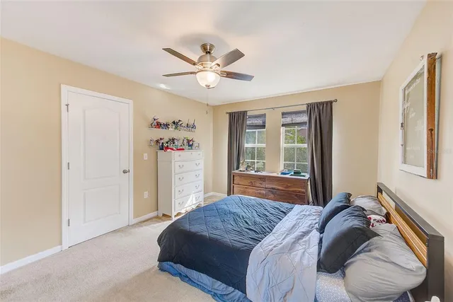 a view of walk in closet with clothes