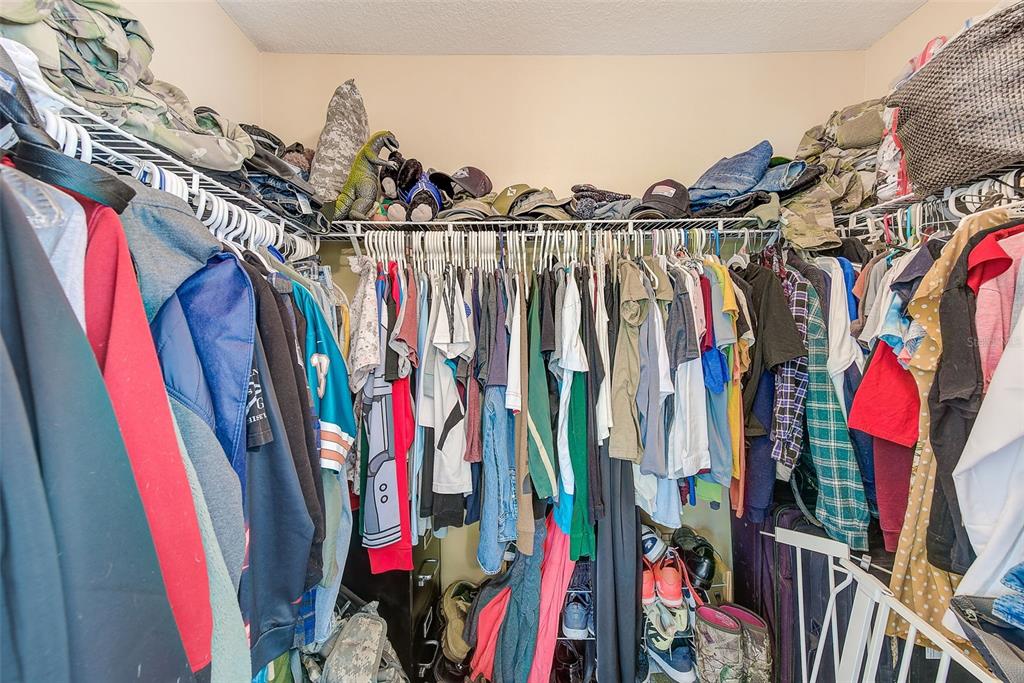 780 Spring Flowers Trail Brandon, FL 33511 - Photo 22 of 33 a view of walk in closet with clothes