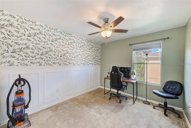 a backyard of a house with yard table and chairs