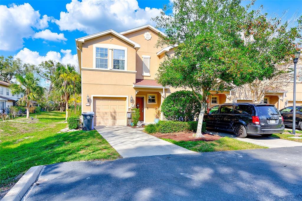 780 Spring Flowers Trail Brandon, FL 33511 - Photo 28 of 33 a front view of a house with a yard and garage