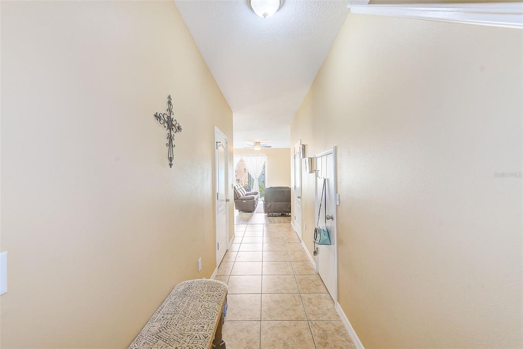 780 Spring Flowers Trail Brandon, FL 33511 - Photo 3 of 33 a view of a hallway with a white walls