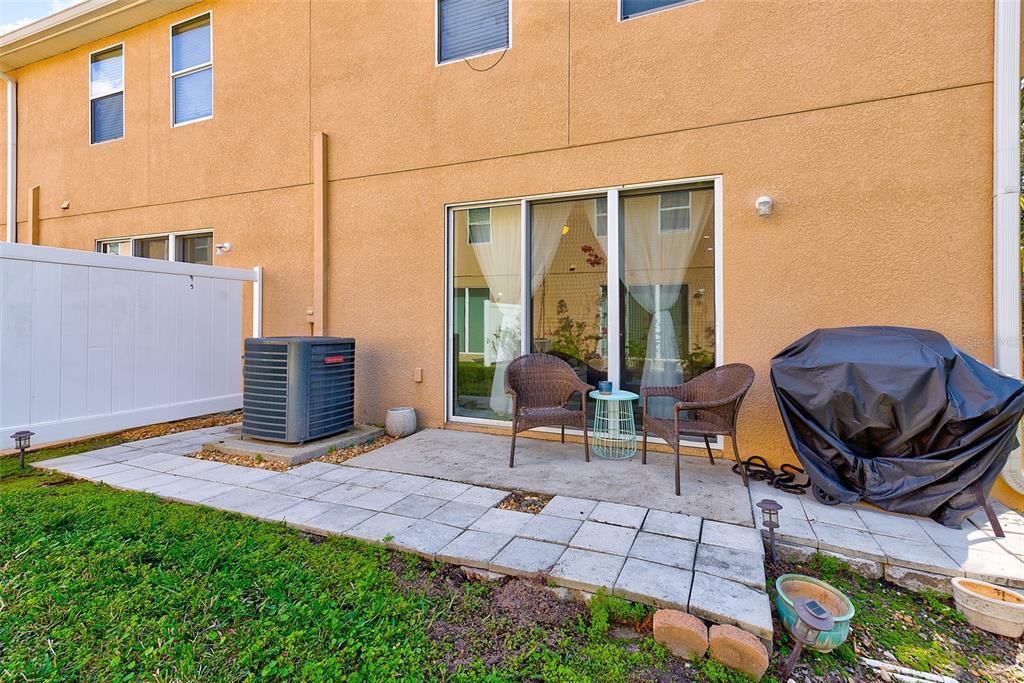 780 Spring Flowers Trail Brandon, FL 33511 - Photo 33 of 33 a view of a patio with couple of chairs and a yard