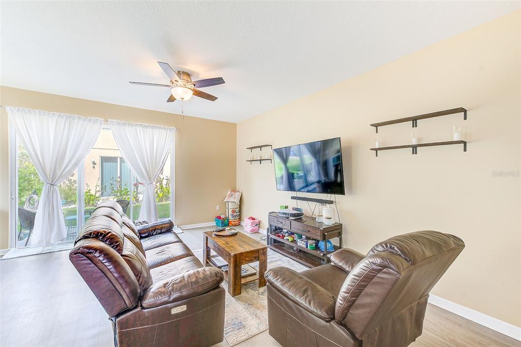 780 Spring Flowers Trail Brandon, FL 33511 - Photo 4 of 33 a living room with furniture and a flat screen tv