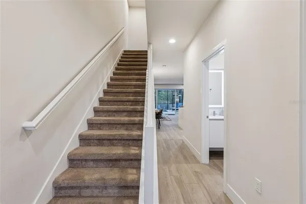 a view of an entryway with wooden floor