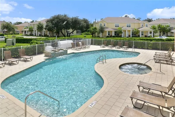 a view of a swimming pool with a patio