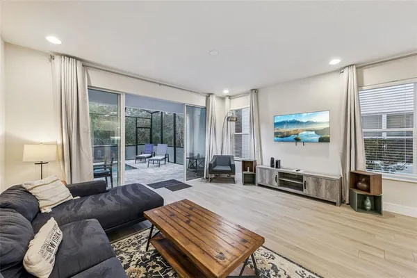 a living room with furniture or couch and a wooden floor