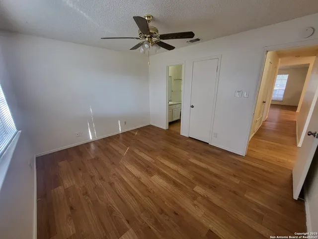 a very nice looking room with a ceiling fan