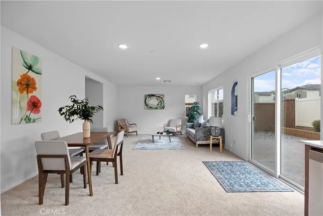 a living room with furniture and a rug