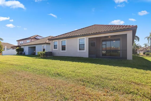 a front view of house with yard and garage