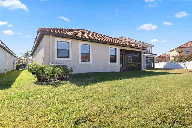 a view of a lake with houses in the background