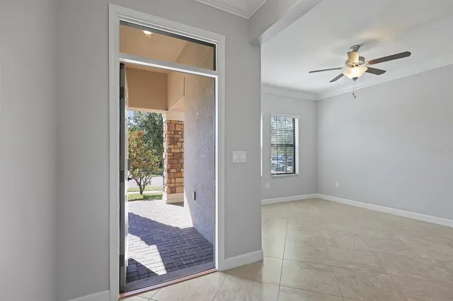 a view of an empty room with a window