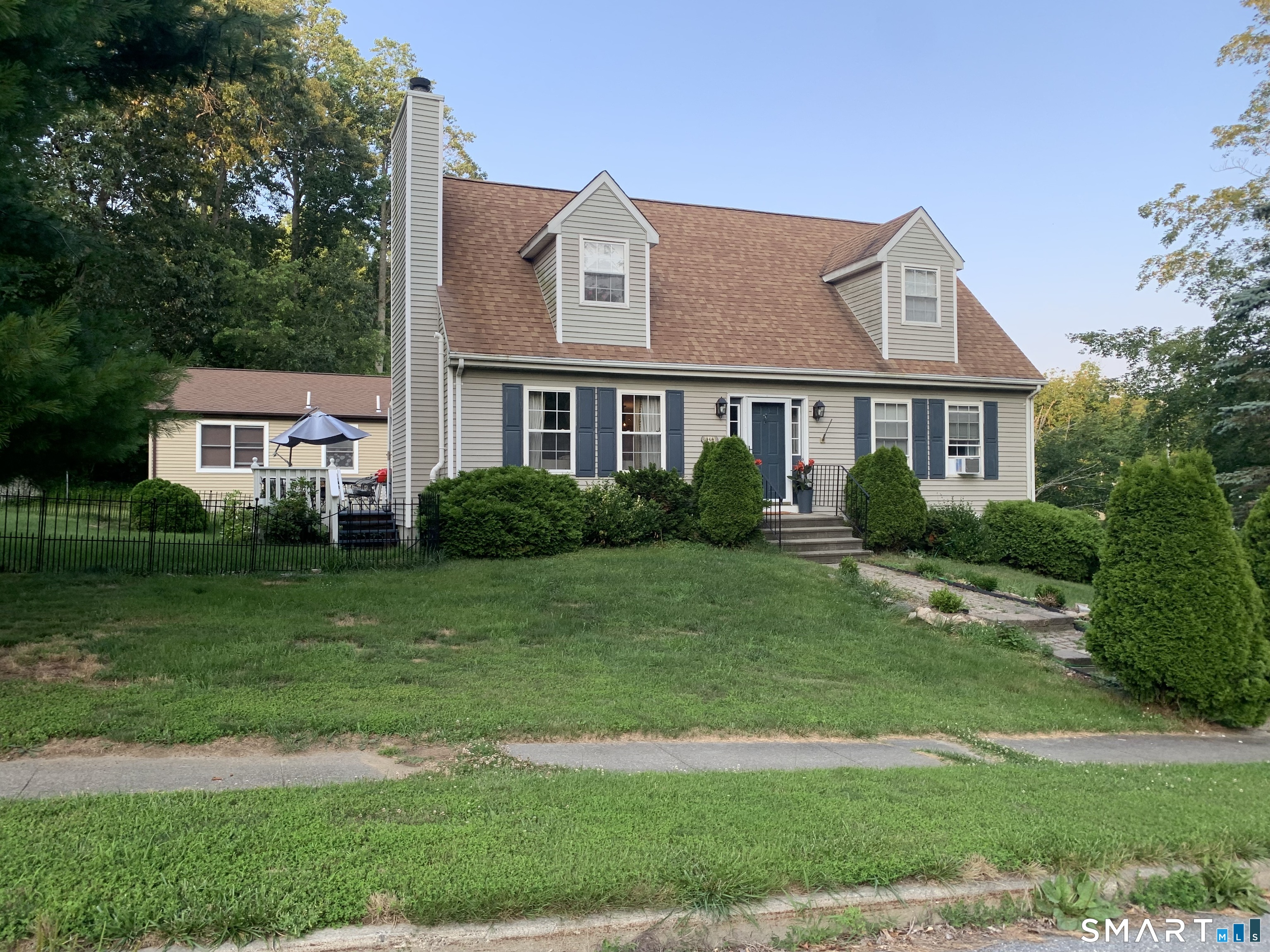 a front view of a house with a yard