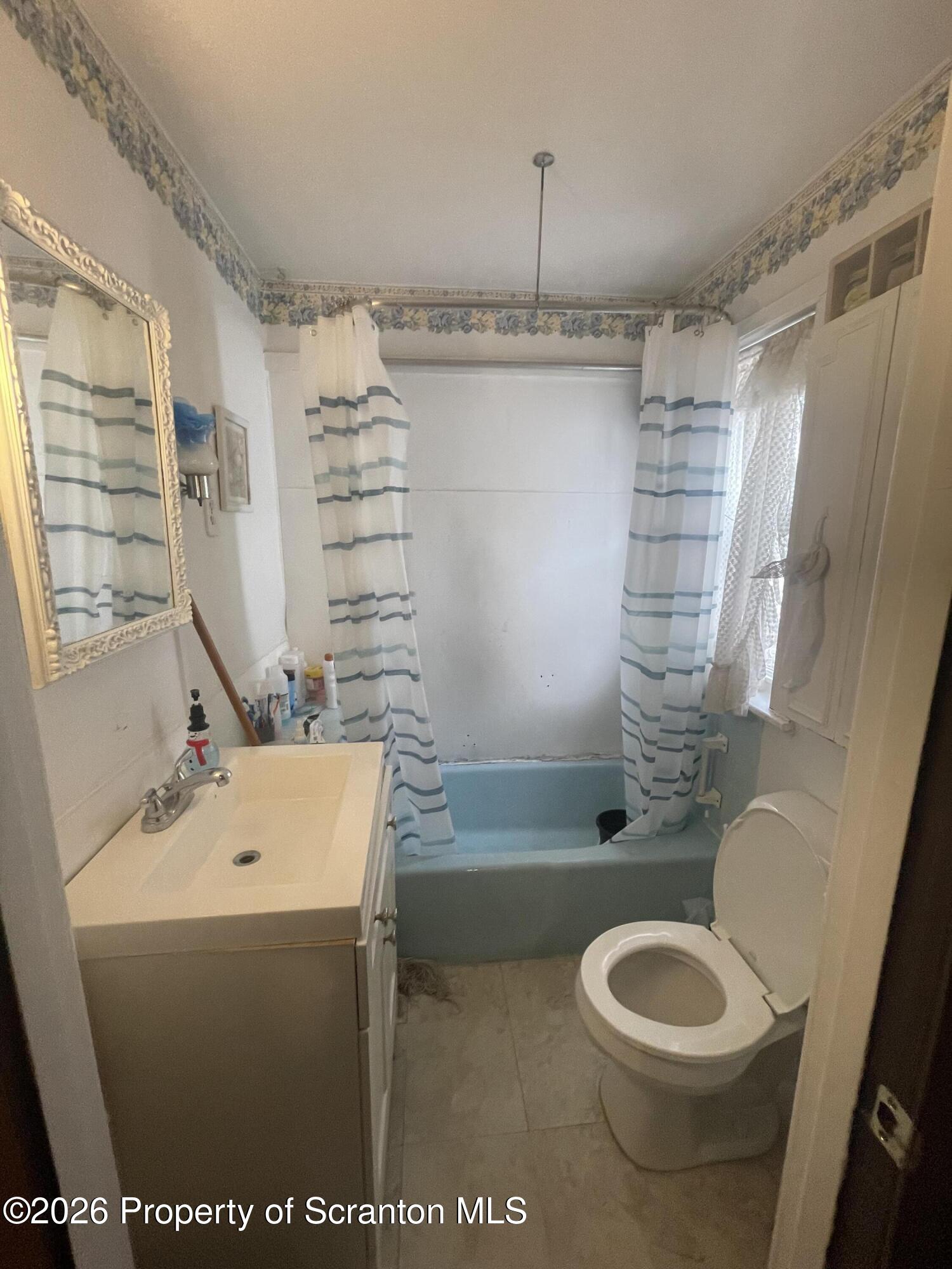 812 Willow Street Scranton, PA 18505 - Photo 17 of 19 a bathroom with a sink a toilet and shower
