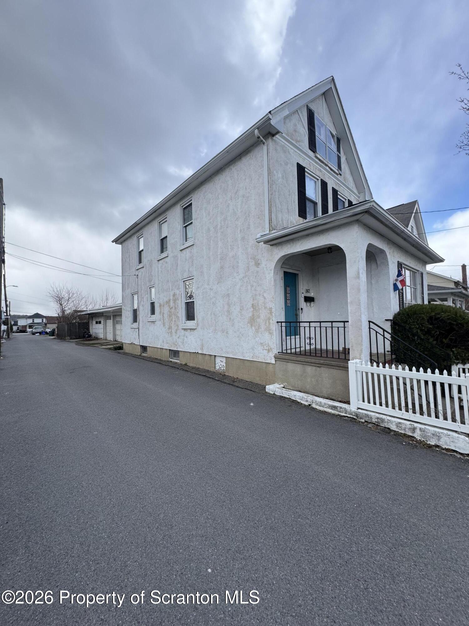 812 Willow Street Scranton, PA 18505 - Photo 3 of 19 a view of a house with a wooden fence