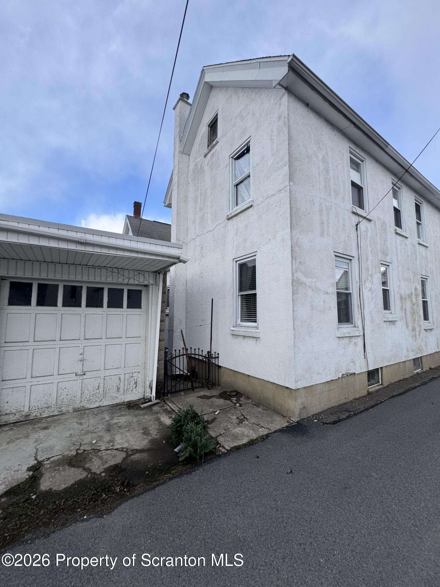 812 Willow Street Scranton, PA 18505 - Photo 4 of 19 a view of a white house with a large window