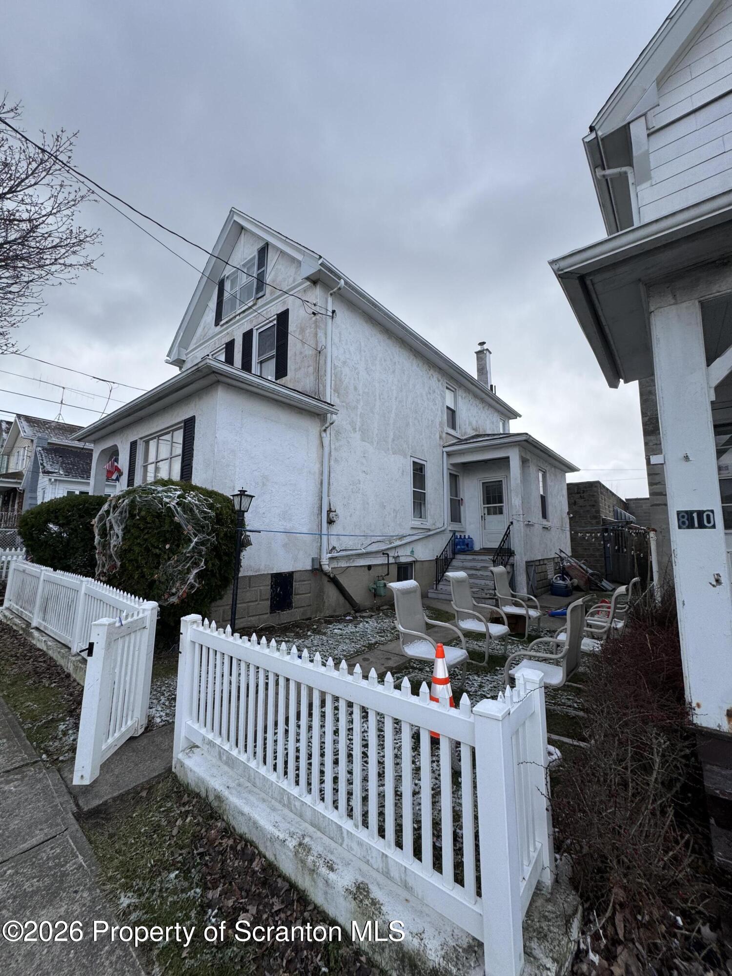 812 Willow Street Scranton, PA 18505 - Photo 5 of 19 a view of a house with wooden fence and furniture