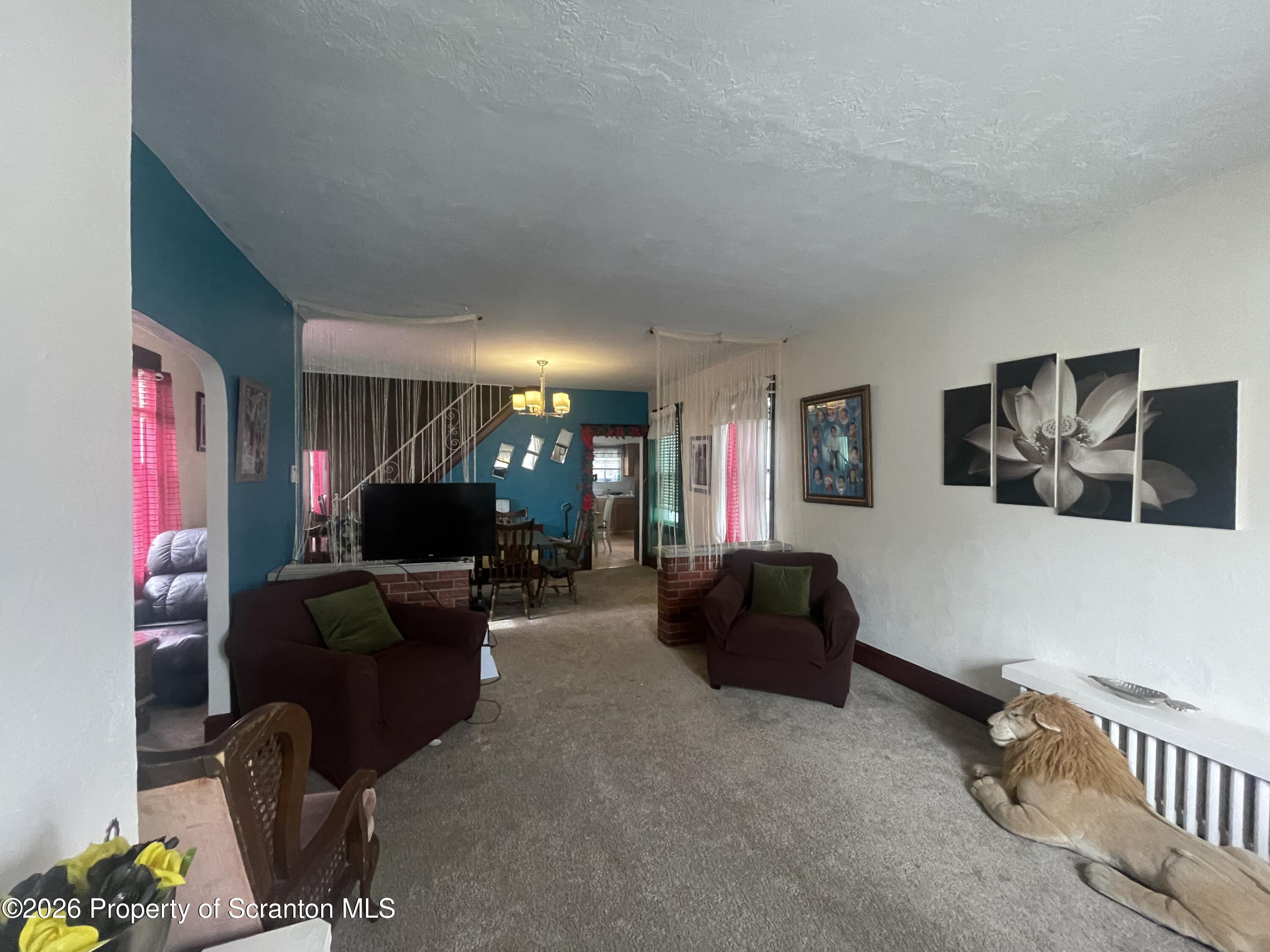 812 Willow Street Scranton, PA 18505 - Photo 8 of 19 a living room with furniture and a flat screen tv