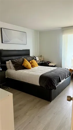 a bedroom with a bed and a couch