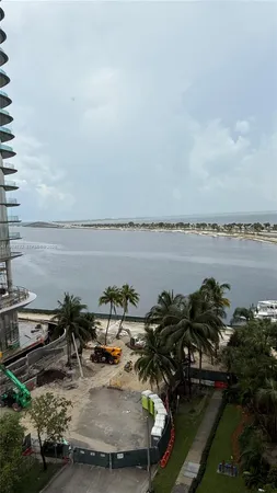 a view of a lake with sitting area