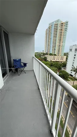 a view of balcony with furniture
