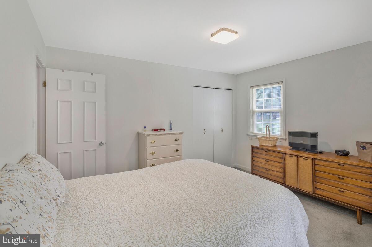 22 Robshire Manor Road Huntingtown, MD 20639 - Photo 18 of 44 a bedroom with a bed and a closet