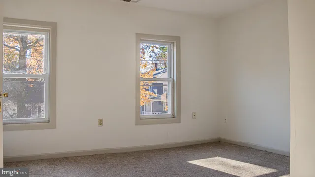 an empty room with windows