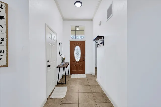 a hallway with sliding door and windows