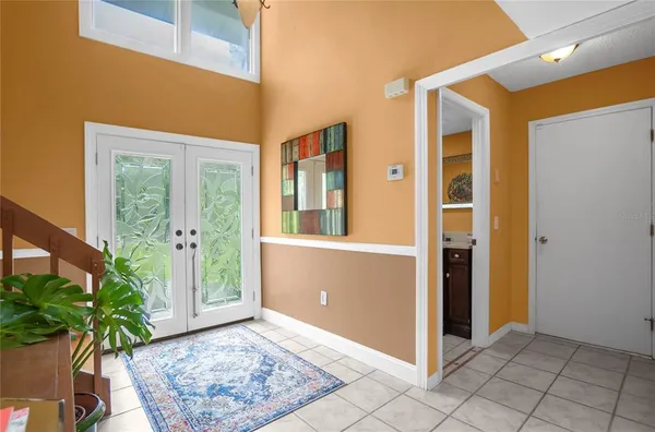 a view of livingroom with furniture and a potted plant