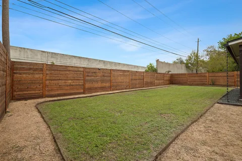 a view of a house with backyard porch and sitting area