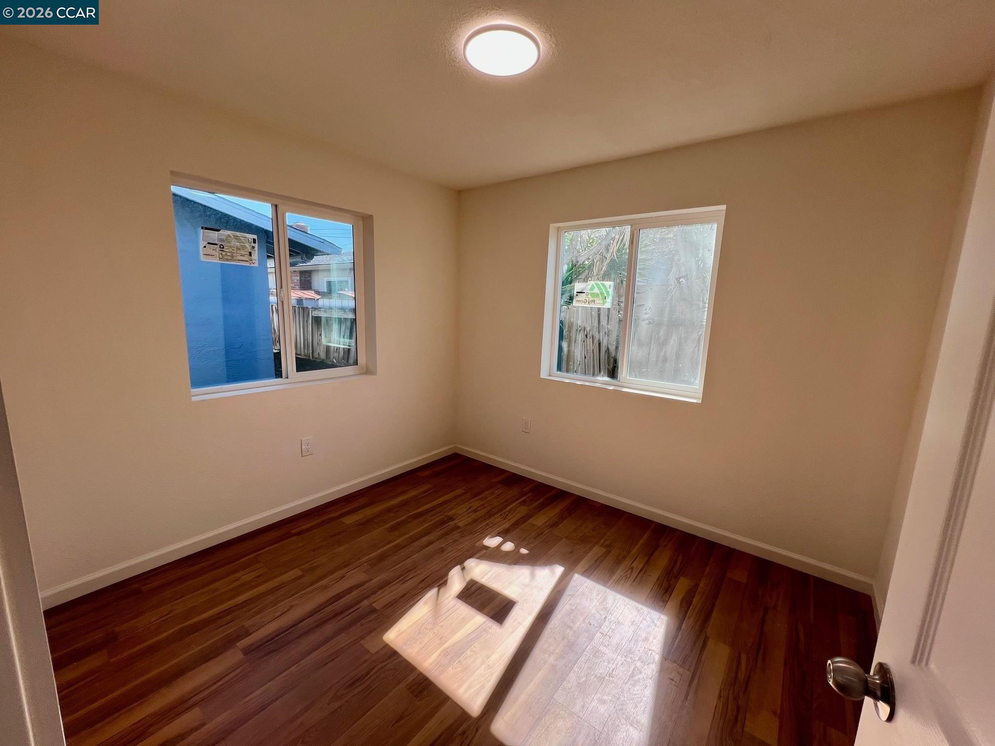 29 Sandview Drive Bay Point, CA 94565 - Photo 22 of 26 a view of an empty room with wooden floor and a window