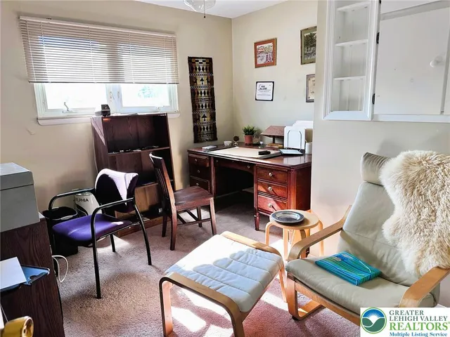 a workspace with furniture and window